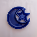 Celestial moon and star resin trinket tray in navy blue on soft lilac background